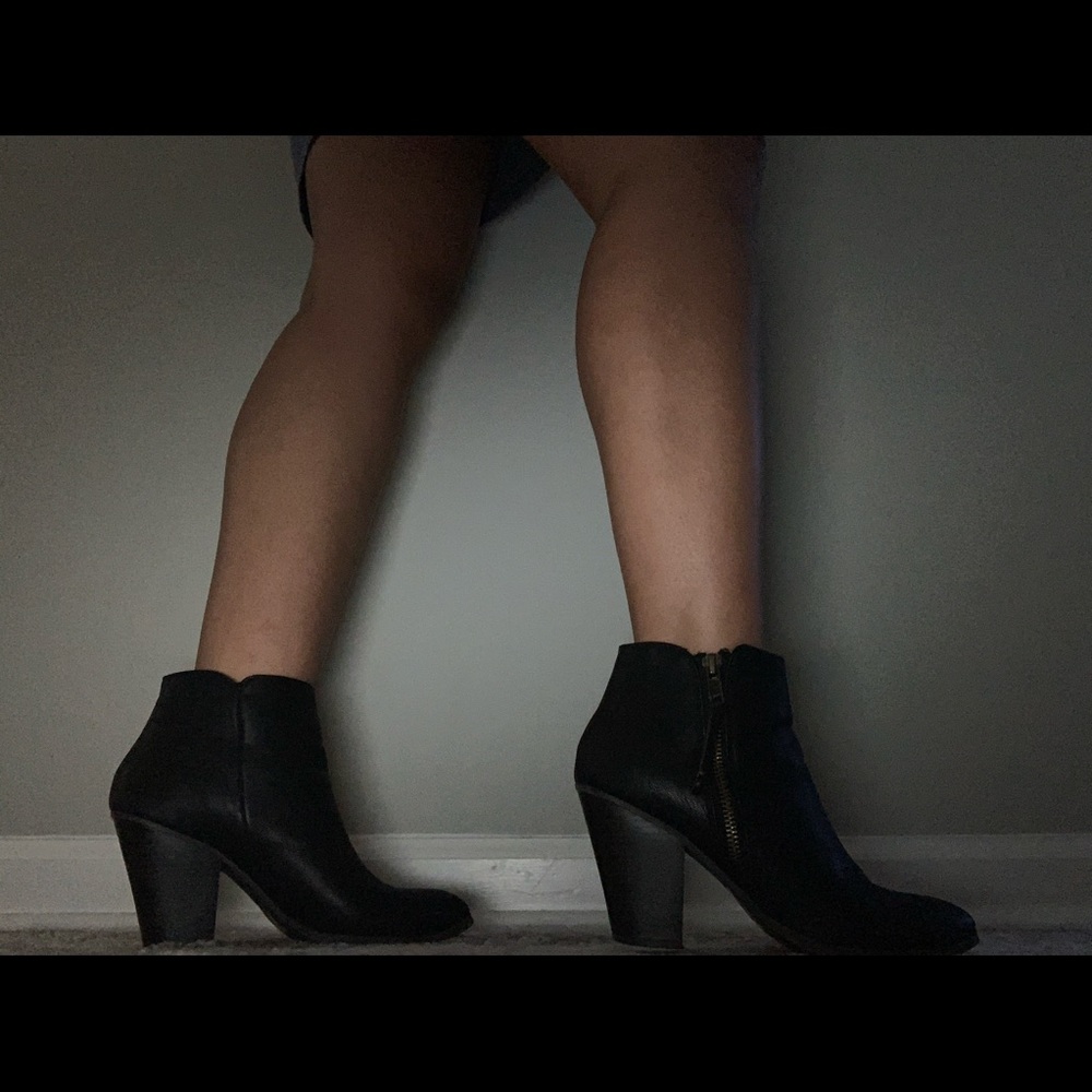 Black mid rise boots.